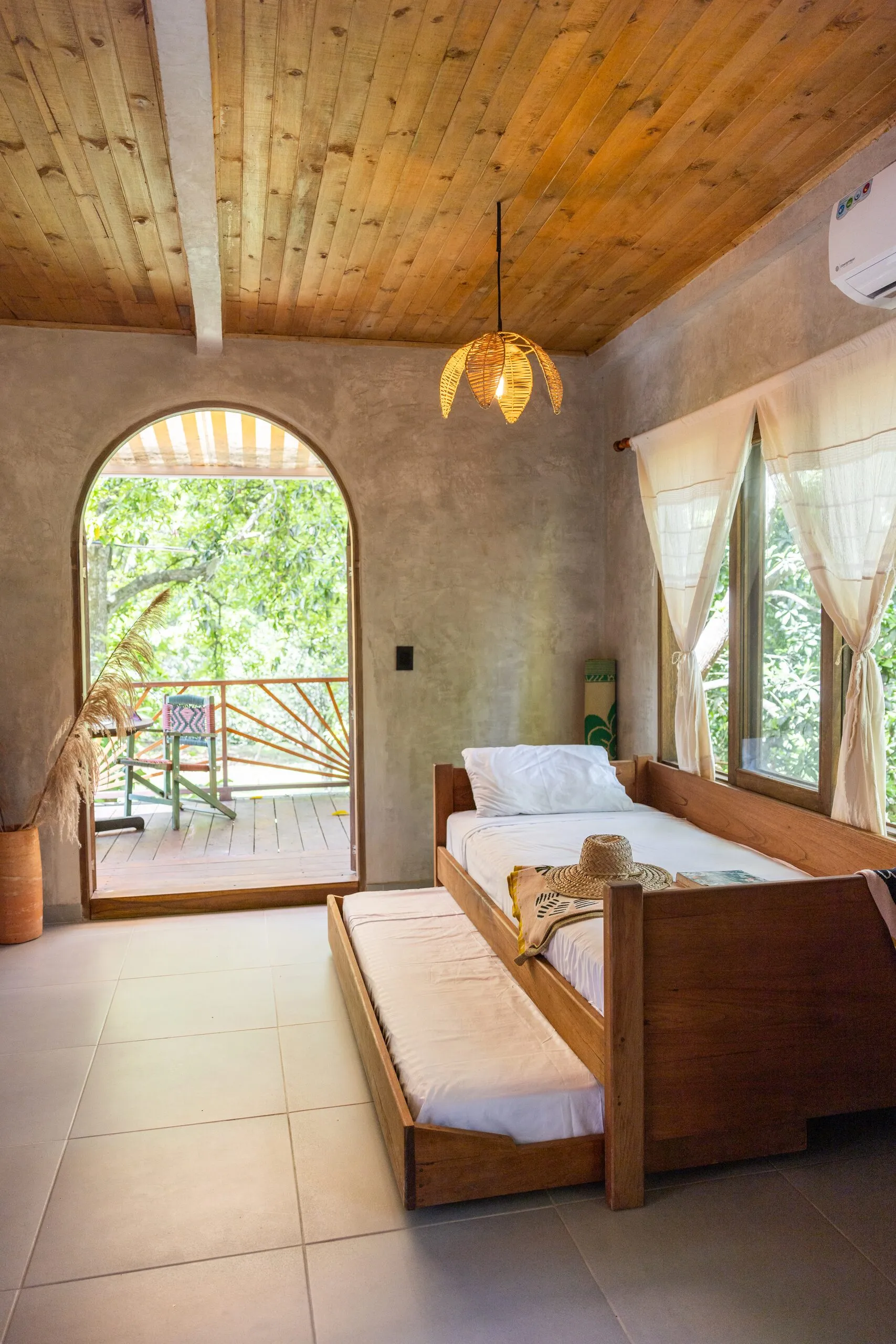 Daybed facing the arched door