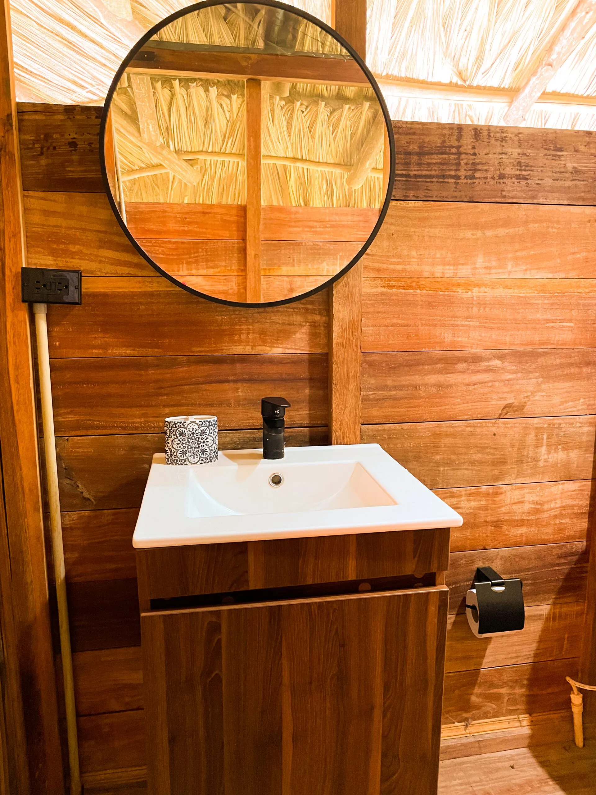 Sink and round mirror