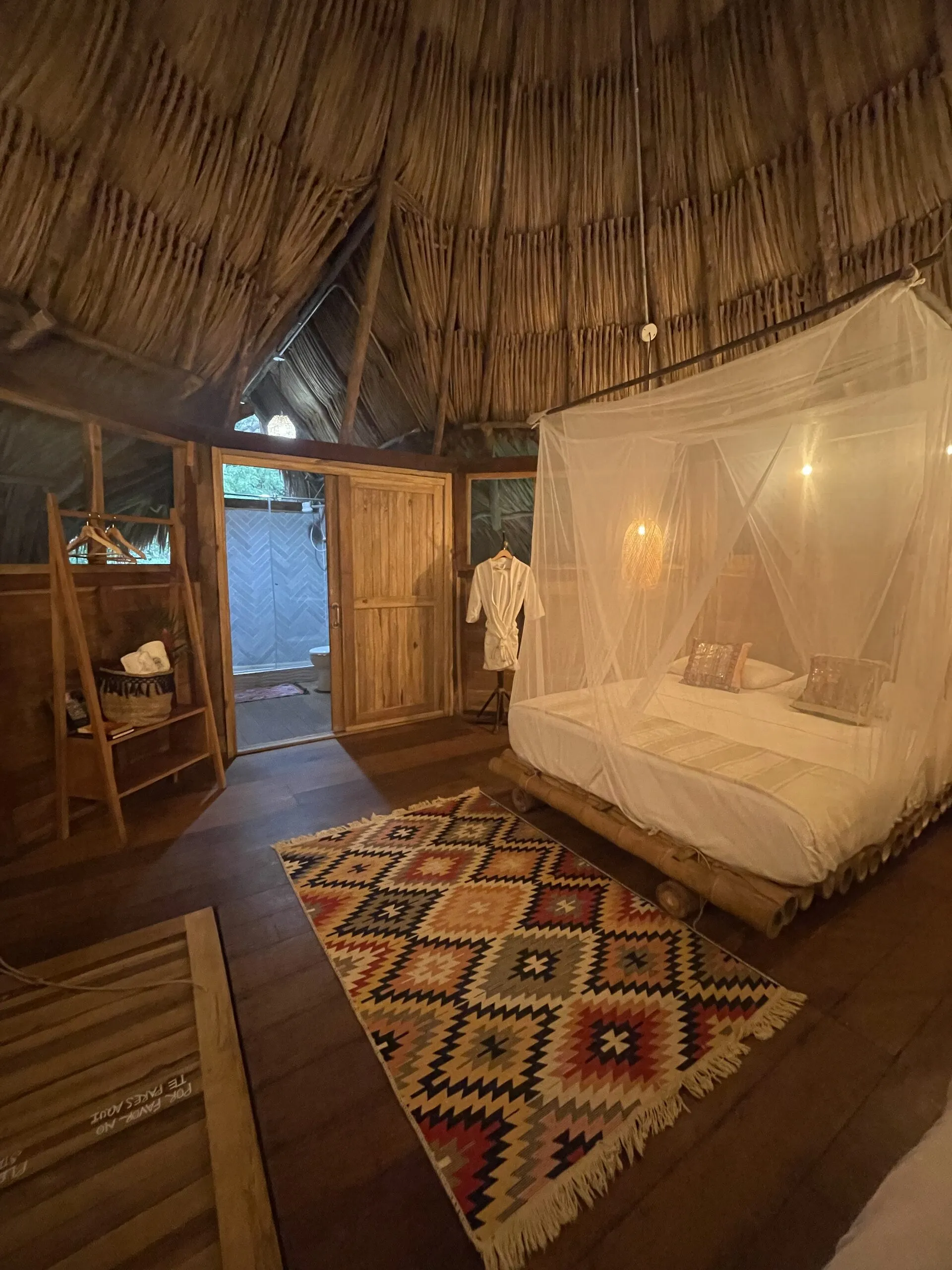 Canopy bed and diamond-pattern rug