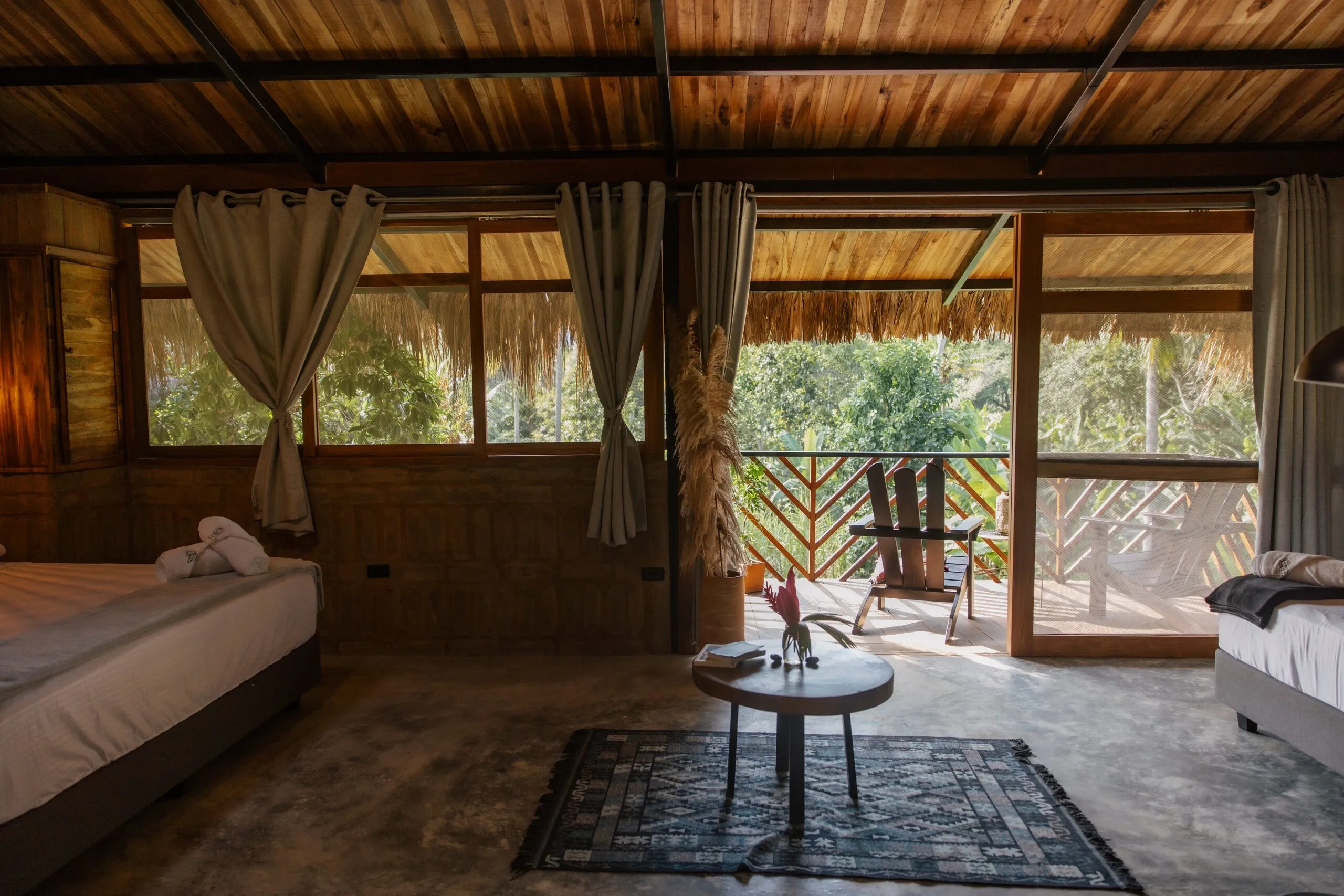 Room with wide windows to the forest