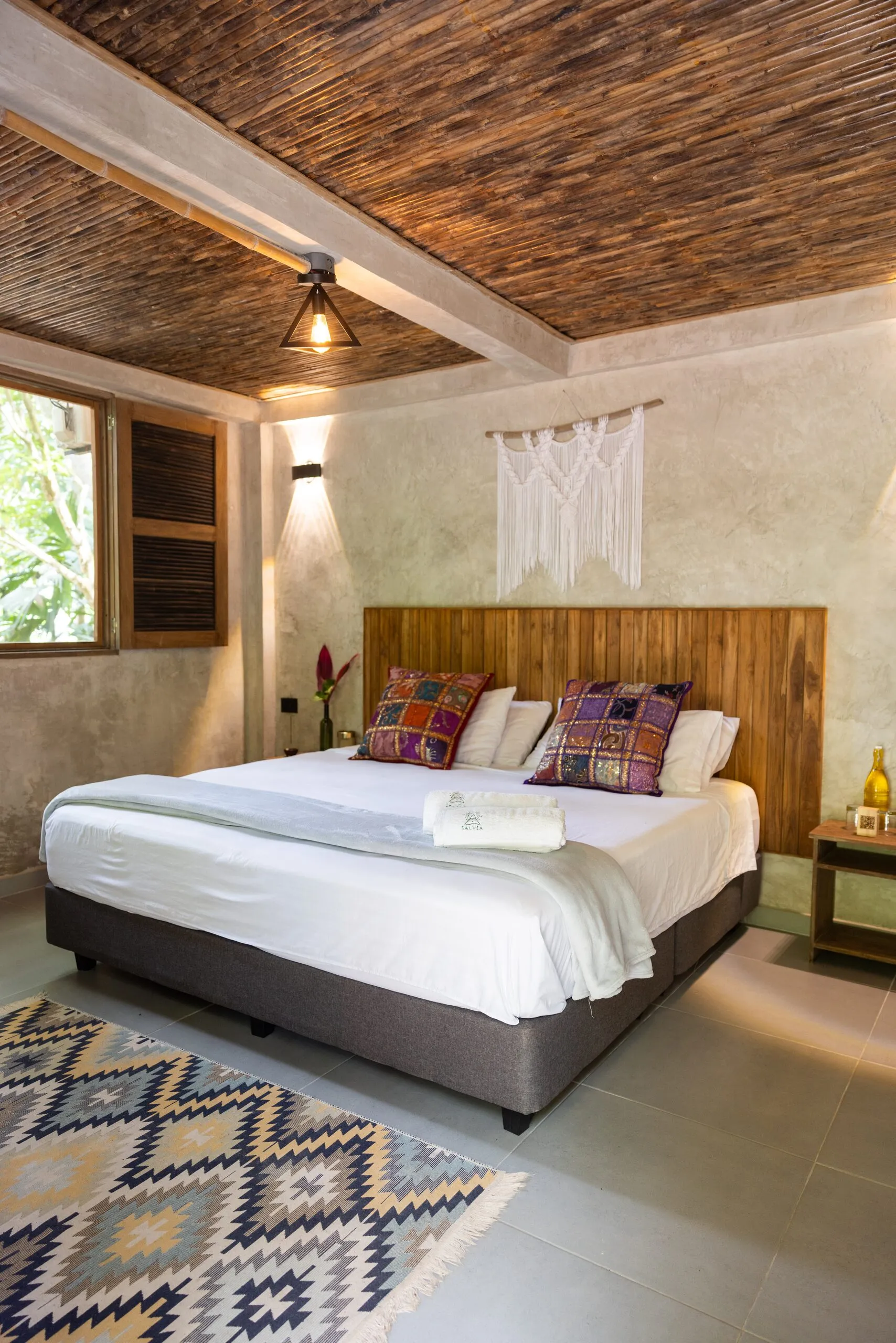 Bed with colorful cushions