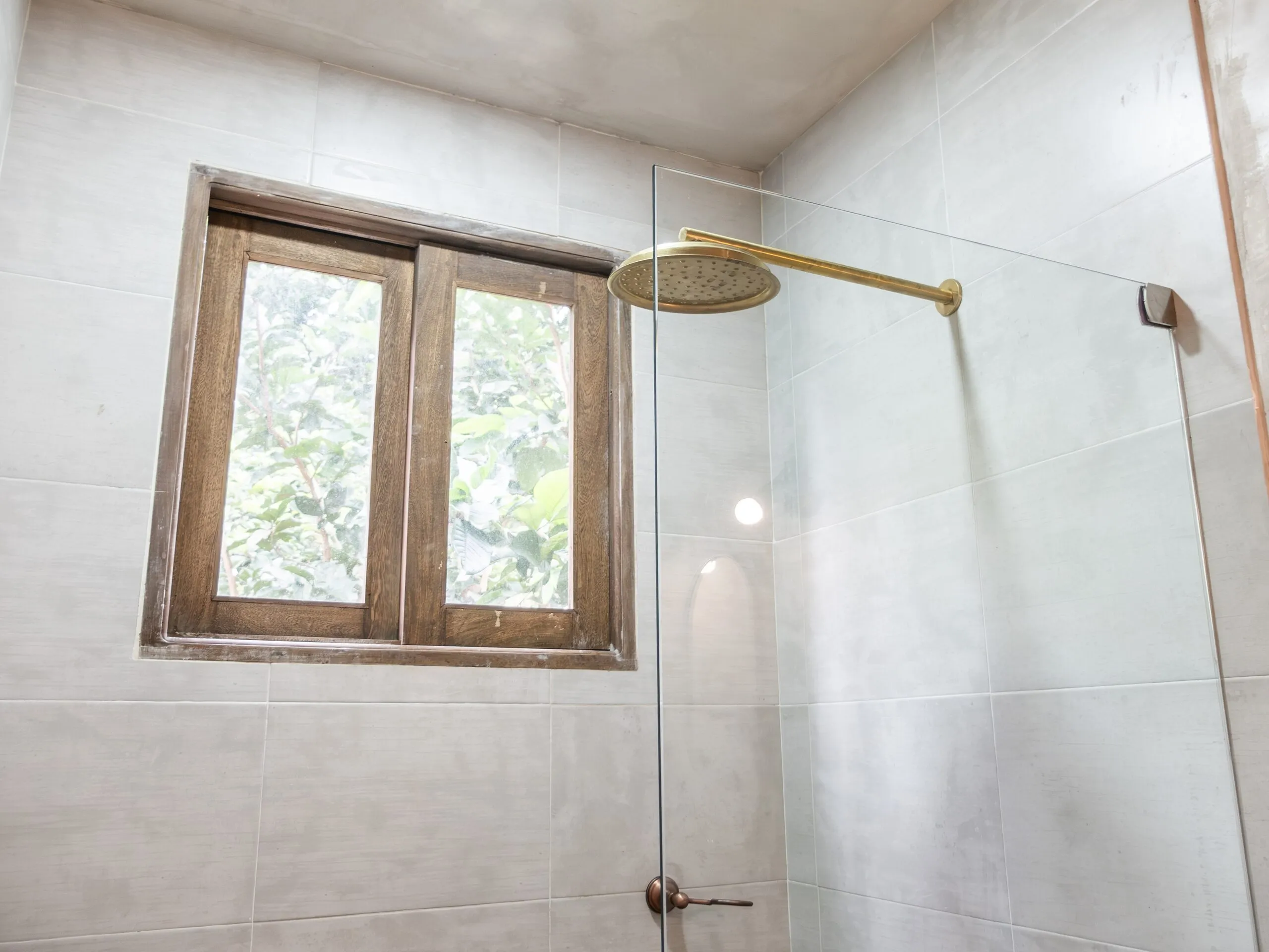 Shower with a wooden window